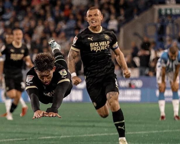 Callum Lang celebrates his late winning goal at Huddersfield