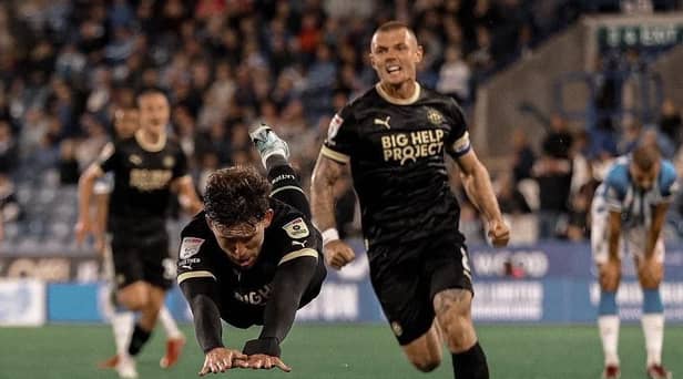 Callum Lang celebrates his late winning goal at Huddersfield