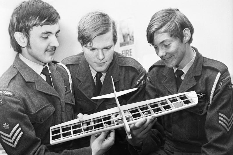 Studying a Gazelle stunt and combat model aircraft are, left to right, Flight Sgt. Phil Marsden, Leading cadet Stuart Bowen and Sgt. John Kay of the Wigan Air Training Corps squadron on Friday 24th of November 1972.