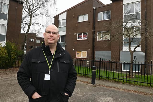 Atherton Councillor Stuart Gerrard pictured outside flats near Elizabeth Street.