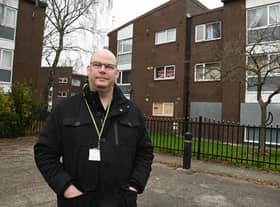 Atherton Councillor Stuart Gerrard pictured outside flats near Elizabeth Street.