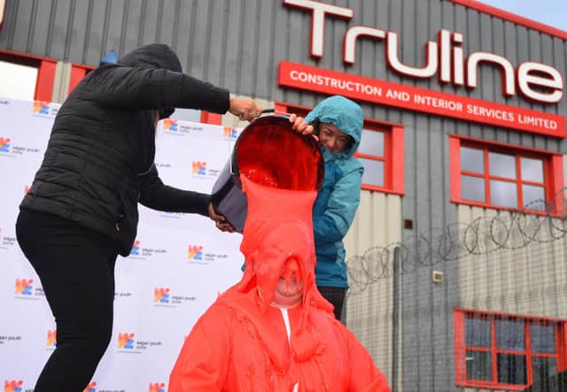 The moment Mike gets covered in red gunge.