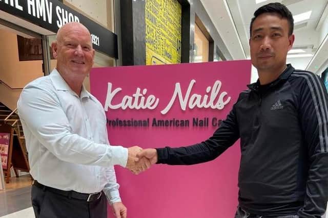 Mike Matthews, Grand Arcade centre manager (left) and Katie Nails manager Duy Dong Mac