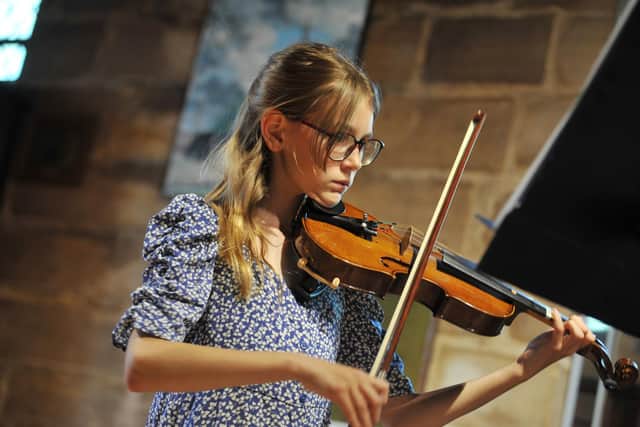 A flashback to the 2021 Wigan Young Musician of the Year Final, held at St Wilfrid's Parish Church, Standish. Paulina Janowska playing the violin
