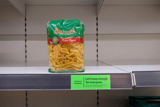 Almost-empty shelves where pasta would normally be stocked are pictured inside a supermarket store in north London (Photo: ISABEL INFANTES/AFP via Getty Images)