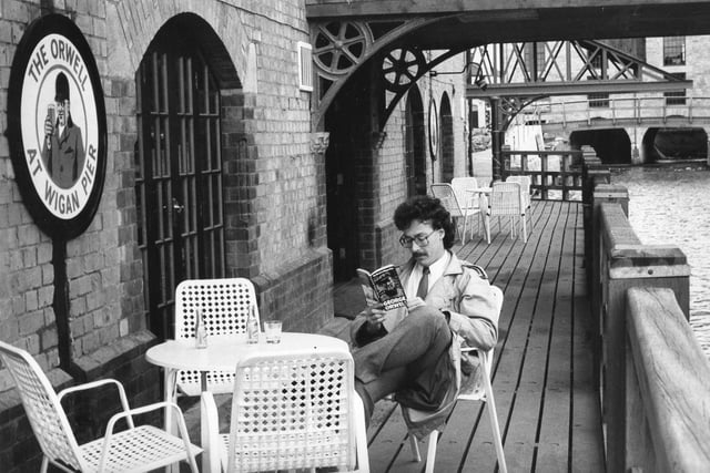 1984 and all that....The Orwell pub and restaurant at the Wigan Pier complex with journalist Paul Jones reading the great man's work The Road to Wigan Pier