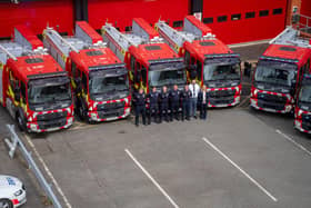 Leigh firefighters in front of their new engine with Head of Fleet Kris Smedley and Director of Resources Andrea Heffernan