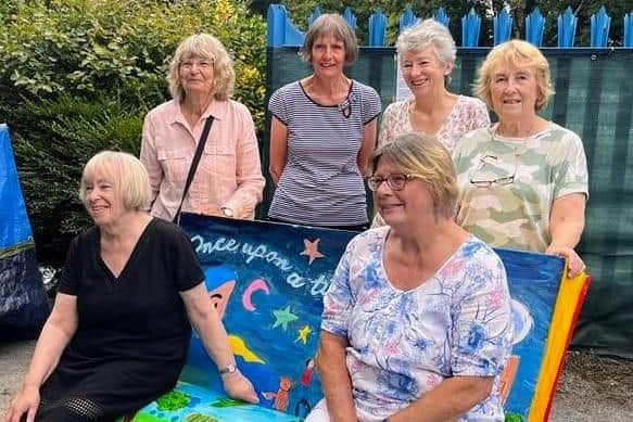 Members of the Friends of Standish Library with the new reading bench