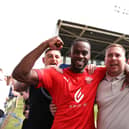 Gavin Massey celebrates with the Latics fans after the victory at Shrewsbury in 2022 that secured the League One title