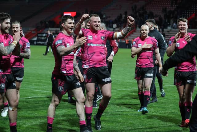 Brad Singleton celebrates with the rest of the Wigan squad following the Toulouse victory
