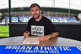 Callum McManaman signs his new 12-month contract with Latics