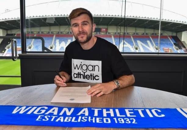Callum McManaman signs his new 12-month contract with Latics