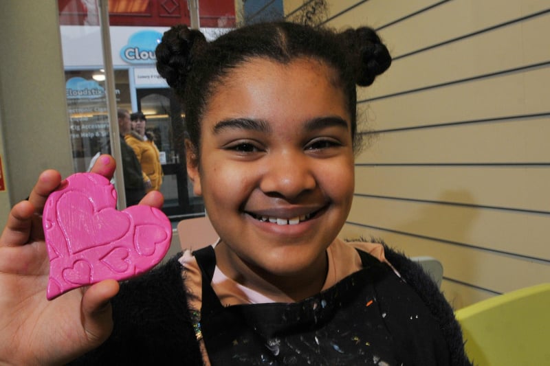 Yasmin Baker, 16, with her pink heart during a Valentine's Day craft session in Makinson Arcade in 2019