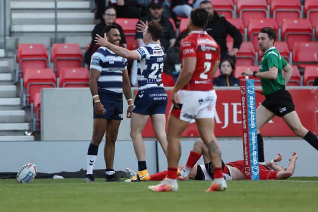 Bevan French celebrates with Jai Field after scoring his first try
