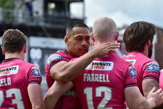 Willie Isa celebrates with his teammates in what was his 250th Super League appearance.