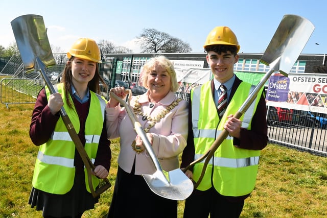 The Mayor of Wigan Coun Marie Morgan, centre, with pupils head girl Keira Aspinall, left, and head boy Toby Devereux, right, as the Mayor was invited to put the first spade in the ground at a ceremony to celebrate the beginning of construction for the new school building in the grounds of Byrchall High School, Ashton-in-Makerfield.