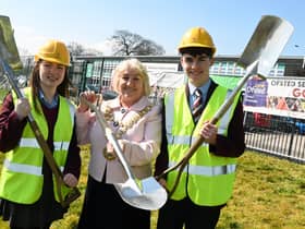 The Mayor of Wigan Coun Marie Morgan, centre, with pupils head girl Keira Aspinall, left, and  head boy Toby Devereux, right,  as the Mayor was invited to put the first spade in the ground at a ceremony to celebrate the beginning of construction for the new school building in the grounds of Byrchall High School, Ashton-in-Makerfield.