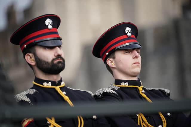 Members of the Honourable Artillery Company fire a gun salute from the wharf at the Tower of London to mark the official start of the Platinum Jubilee. Picture date: Monday February 7, 2022.