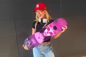 Dancer Robyn Brown with a Royal Family dance crew skateboard, as she prepares to head to New Zealand to join them