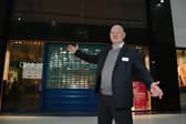 Mike Matthews, general manager of The Grand Arcade shopping centre, Wigan, next to the empty until that will become a Trespass outlet next month