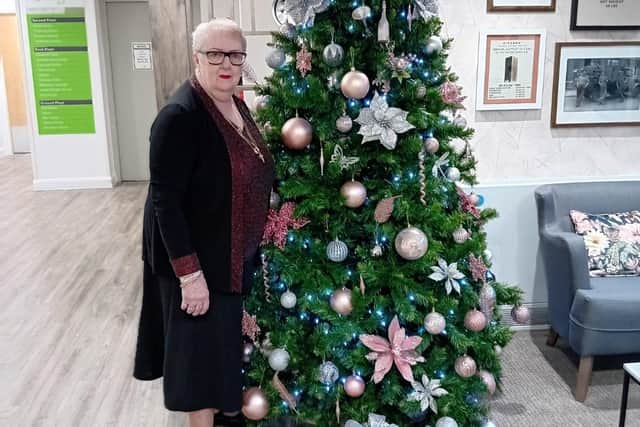 Margaret Jones, apartment tenant at Belong Atherton, gets into the Christmas spirit