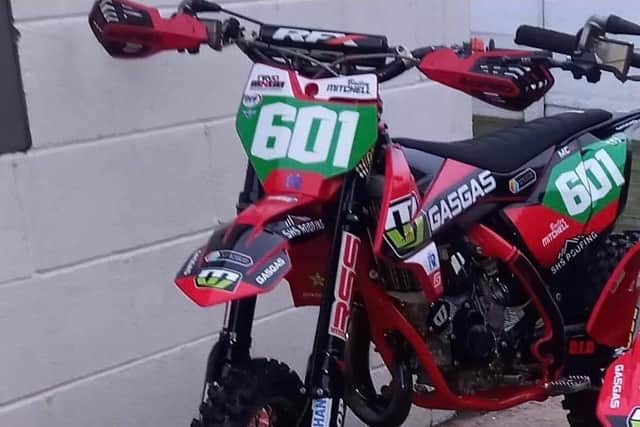 Bailey Mitchell's red gas-gas motocross bike with "601" which was his uncle's date of birth.