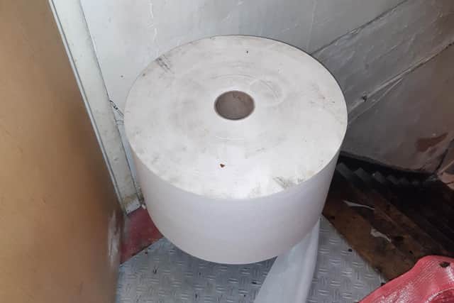 Dirty white roll used to clean surfaces and hands at Frankies Chicken and Pizza