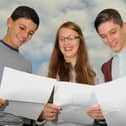 Students get their GCSE result at The Deanery, Wigan - from left, Jack Hunter,16, Emma Belfield, 16, and Adam Fairhurst, 16.