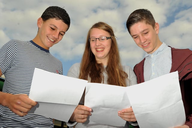 Students get their GCSE result at The Deanery, Wigan - from left, Jack Hunter,16, Emma Belfield, 16, and Adam Fairhurst, 16.