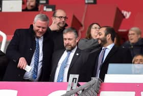 Latics CEO Mal Brannigan, pictured last season flanked by chairman Talal Al Hammad and board member Dr Tom Markham