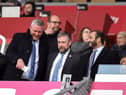 Latics CEO Mal Brannigan, pictured last season flanked by chairman Talal Al Hammad and board member Dr Tom Markham