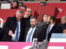 Latics CEO Mal Brannigan, pictured last season flanked by chairman Talal Al Hammad and board member Dr Tom Markham