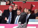 Latics CEO Mal Brannigan, pictured last season flanked by chairman Talal Al Hammad and board member Dr Tom Markham