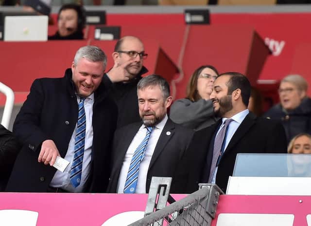 Latics CEO Mal Brannigan, pictured last season flanked by chairman Talal Al Hammad and board member Dr Tom Markham