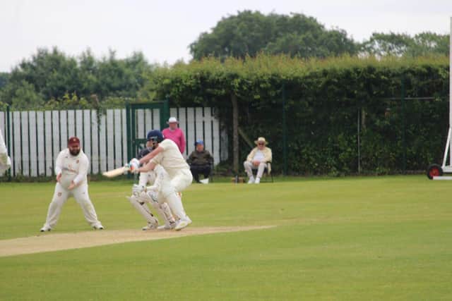 Dominic Hayes in batting action