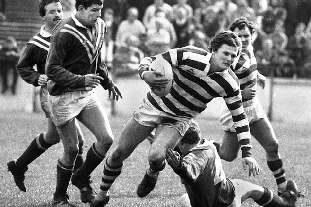 Wigan full-back Colin Whitfield slips a tackle against St. Helens in a league match at Central Park on Sunday 25th of April 1982.
Wigan won 23-5.
