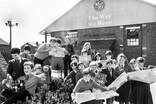 Whelley Middle School pupils swot up on events in 1901 with copies of old editions of the Wigan Observer during a visit to The Way We Were at Wigan Pier on Tuesday 29th of April 1986.