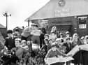 Whelley Middle School pupils swot up on events in 1901 with copies of old editions of the Wigan Observer during a visit to The Way We Were at Wigan Pier on Tuesday 29th of April 1986.