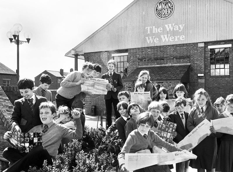 Whelley Middle School pupils swot up on events in 1901 with copies of old editions of the Wigan Observer during a visit to The Way We Were at Wigan Pier on Tuesday 29th of April 1986.
