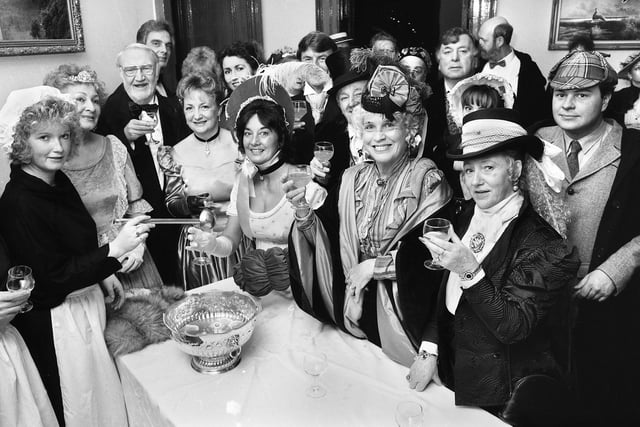 A glass of warming punch for guests arriving for a Victorian evening organised by Wigan Leisure Department at Haigh Hall on Tuesday 19th of December 1989.