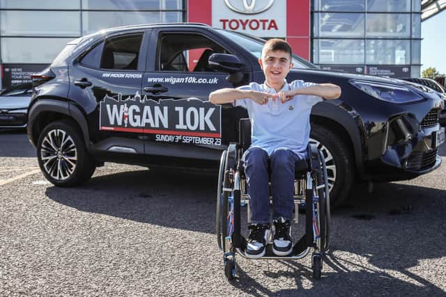 Jack Johnson, from Joining Jack, collects the lead car for the Wigan 10k from HW Moon Toyota. Pic: Michelle Charnock Photography