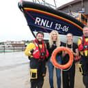 Megan and Brogan Griffiths with an RNLI crew from New Brighton