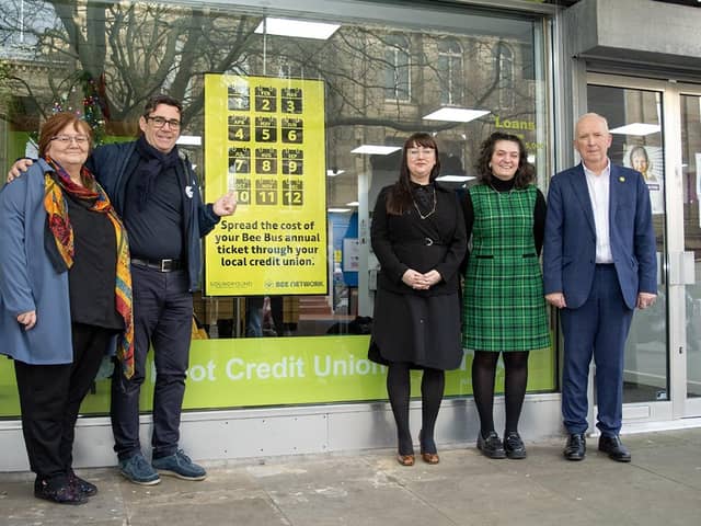 Andy Burnham outisde Hoot Credit Union with Chris Canham, Rebecca Frost and Josie Shohet of SoundPound Group, and Transport Commissioner Vernon Everitt