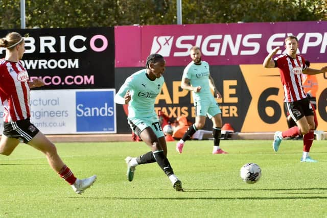 Martial Godo puts Latics ahead at Exeter last month