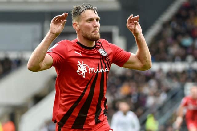 Charlie Wyke has been earmarked as Latics' man to stop this weekend by Cambridge head coach Mark Bonner