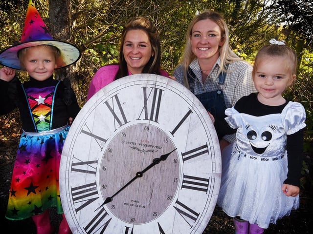 Family fun at a pumpkin picking and Hallowe'en event at Apple Cast Farm, Newburgh in 2021. From left: Connie Boyd, three, Erin Boyd, farm manager Shannon Caffrey and Arabella Speakman, two, remind readers about the clock change