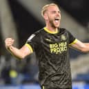 Jack Whatmough celebrates Latics' victory at Huddersfield in 2022/23