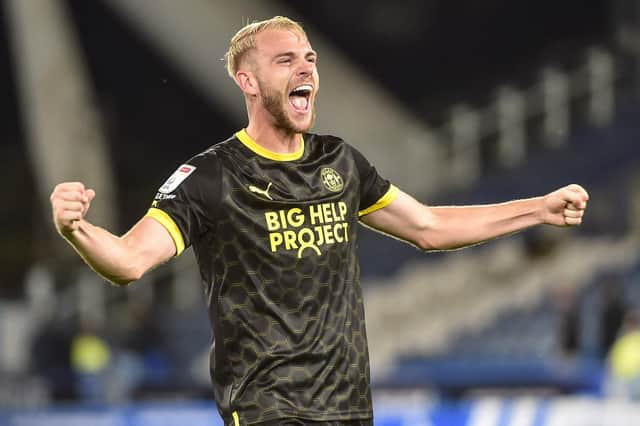Jack Whatmough celebrates Latics' victory at Huddersfield in 2022/23