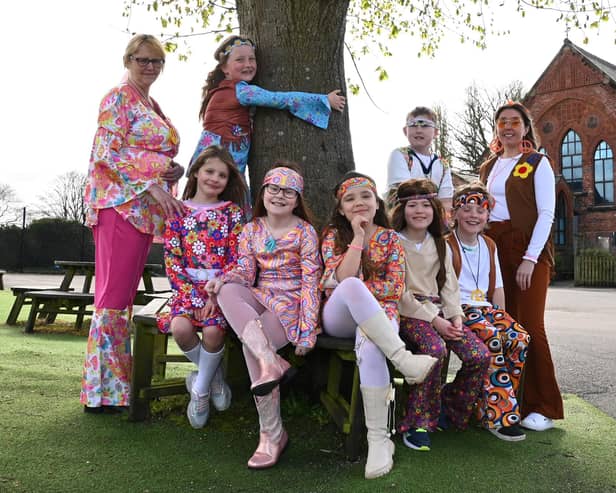 Staff and pupils at St John’s Primary school, Pemberton, celebrate in style as they dressed up in clothes to represent different decades to commemorate the 140th anniversary of their school.