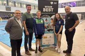 From left to right: Coun Chris Ready, Steve Parry from Fielden Factors, Wigan BEST swimmers Cain Ashton and Libby Woods, and Tim Hilton of JJH Contractors Ltd at Wigan Life Centre